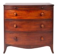 A late George III mahogany bow fronted chest, the top with a reeded edge,