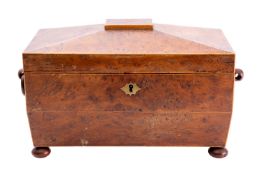 A Regency burr yew wood and sycamore strung tea caddy, circa 1815; of sarcophagus form,