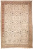 A Contemporary Panderma carpet, the ivory field with an all over palmette and floral spray design,