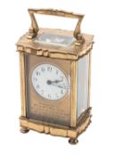 Couaillet frères, a shaped brass carriage timepiece