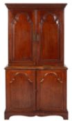An 18th Century oak side cupboard, the upper part with a moulded cornice,