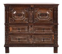 A Jacobean oak rectangular chest, in two parts, with a moulded top,