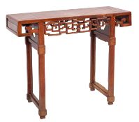 A Chinese hardwood altar table, with a rectangular top and geometrically pierced frieze,