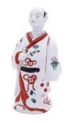 A Japanese Imari figure of an actor, circa 1700 wearing a flowing kimono and holding a fan,