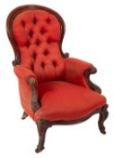 A Gentleman's Victorian carved mahogany armchair,