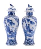 A pair of Chinese blue and white baluster vases and covers,