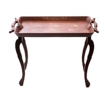 An Anglo-Indian brass inlaid butler's tray on integral folding stand,