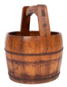 A Chinese wood rice basket, of barrel shape,
