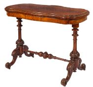 A Victorian walnut and inlaid card table, of serpentine outline,