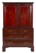 A 19th Century mahogany linen press, the upper part with a moulded dentil cornice,