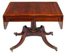 A Regency rosewood and inlaid sofa table, the hinged top with rounded corners,
