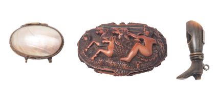 A carved coquilla nut snuff box, early 19th century; of typical oval form,