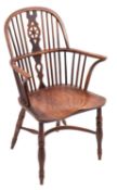 An elm and yew wood wheelback Windsor elbow chair,