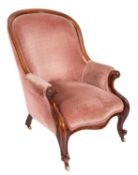 A Gentleman's Victorian mahogany armchair with curved upholstered panel back,