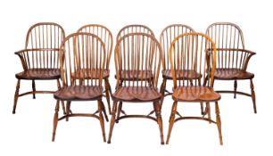 A set of eight ash, elm and oak Windsor elbow chairs, in 18th Century style,