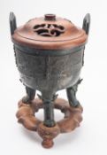 A Chinese bronze 'taotie' tripod censer,