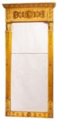 A George IV giltwood and composition pier mirror with central lion mask and scrolling acanthus to