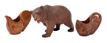 A 'Black Forest' carved and stained wood model of a bear, almost certainly Swiss,