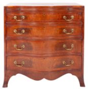 An Edwardian mahogany and inlaid serpentine fronted chest of small size,