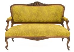 A carved and parcel gilt walnut three piece salon suite, in Louis XV taste,