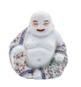 A Chinese famille rose figure of Budai,
