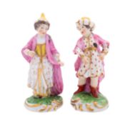 A pair of small Derby figures of a boy and girl in Turkish costume,