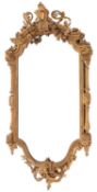 A Victorian and later decorated giltwood and gesso cartouche shaped wall mirror,