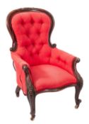 A Gentleman's Victorian carved rosewood and mahogany armchair,