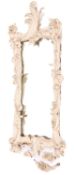 A carved wood and painted cartouche-shaped mirror,