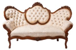 A Victorian carved walnut settee,