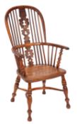 A Victorian yew-wood, elm and ash stick back Windsor elbow chair,