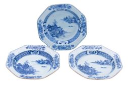 Three Chinese porcelain soup plates each panted in blue with a lakeside temple within borders