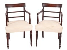 A pair of Regency mahogany elbow chairs,