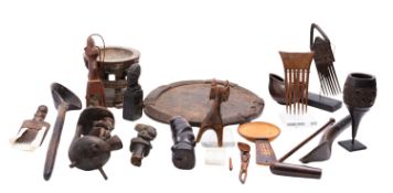 A group of African tribal carved wooden artefacts, 20th century; including three haircombs,