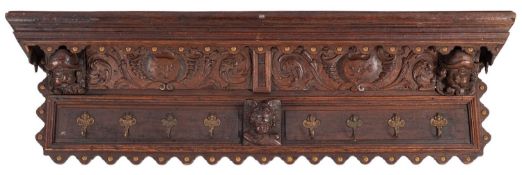 A 19th Century Continental carved oak wall mounted hall rack,