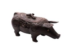 A Dayak iron-wood box and cover in the form of standing pig,
