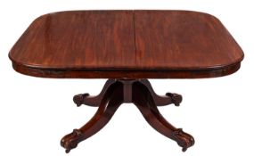 A Victorian mahogany dining table, the rectangular snap top with rounded corners and a moulded edge,