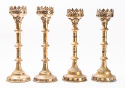 Two pairs of brass altar pricket candlesticks in Gothic taste,