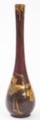 A Japanese gold onlaid and patinated bronze vase, Meiji period with long slender neck,