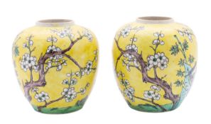 A pair of Chinese famille jaune ginger jars,