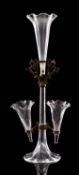A clear glass and brass mounted epergne with one large and three trumpet shaped vases with frill