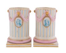 A pair of Royal Worcester vases and a chamber candlestick the vases in the form of classical fluted