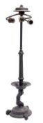 A patinated metal figural table lamp,