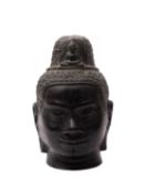 A South-East Asian bronze Buddha head in Khmer style, 23cm.