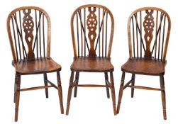 A set of six elm and beechwood wheel and stick back Windsor kitchen chairs,
