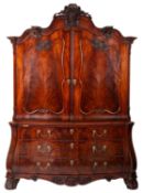 An 18th Century Dutch mahogany serpentine fronted bombe armoire,