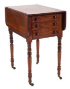 An early 19th Century mahogany drop flap work table,