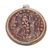 A carved carnelian seal in archaistic style and in the manner of ancient Hittite examples,