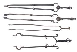 A collection eight various pairs of fire steel and brass fire tongs,