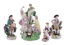 A large Derby figure of 'Two Bacchantes adoring Pan' and three other Derby figures,
